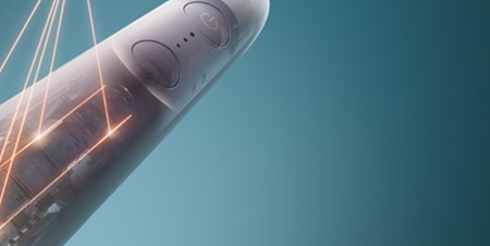 Zbliżenie na wnętrze szczoteczki, z którego roztaczają się laserowe połączenia.