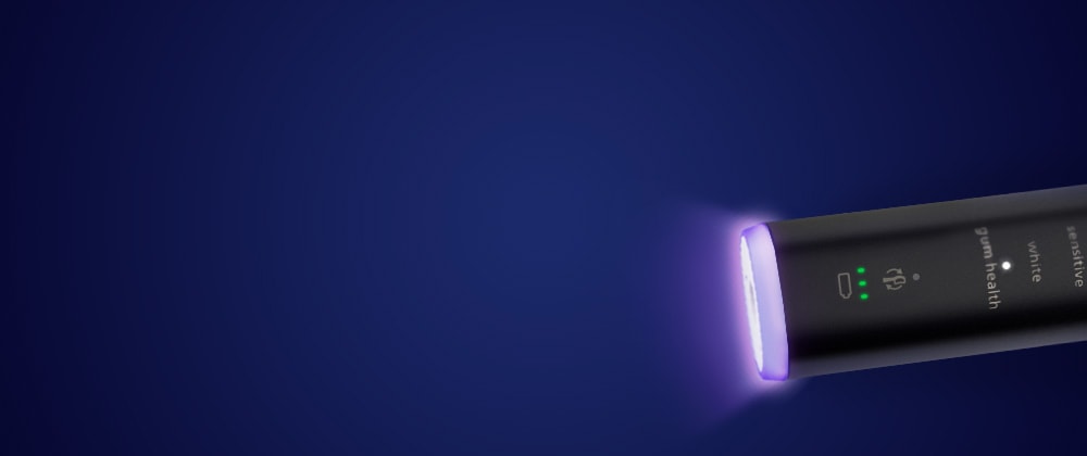 Zbliżenie na dolną część szczoteczki, na której znajduje się czujnik.