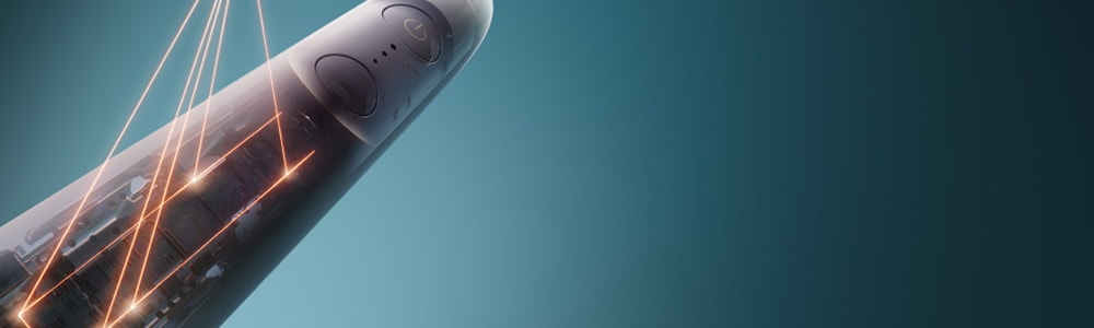 Zbliżenie na wnętrze szczoteczki, z którego roztaczają się laserowe połączenia.